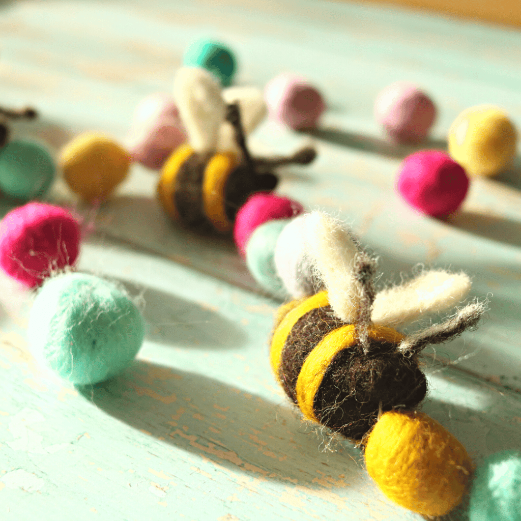 image shows a needle felted spring garland